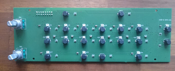 The reworked PCB of an ECAM control panel. There are pots on the left, buttons on LEDs in some sort of a matrix in the middle, on the right are more buttons with the label "A330 & A340 only"